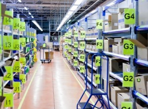 stands with carton boxes in storage warehouse